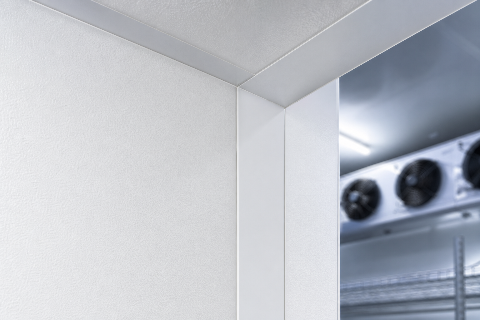 Close-up of perfectly sealed PIR insulated panel joint inside a UK cold room.